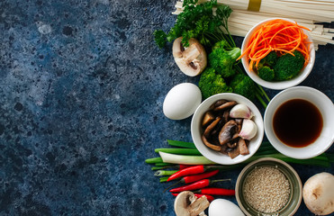 Ingredients of asian cuisine noodles eggs vegetables spices sauc