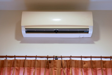 Interior Air Conditioner at a White Painted Living Room Wall
