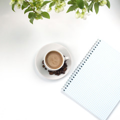 Summer composition of coffee and flowering greens. Accessories.