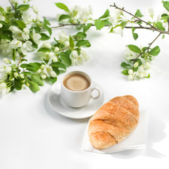 Summer composition of coffee and flowering greens. Accessories.