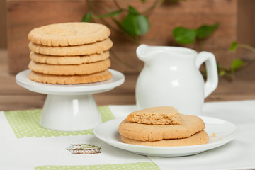 Fototapeta na wymiar Home Baked Peanut Butter Cookies. Handmade Cross Stitch Lunch Mat.