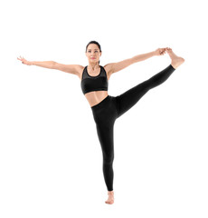 Fototapeta na wymiar Young woman practicing yoga on white background