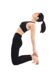 Young woman practicing yoga on white background