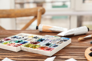 Watercolors of professional artist on table