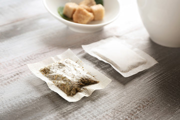 Tea bags on wooden table