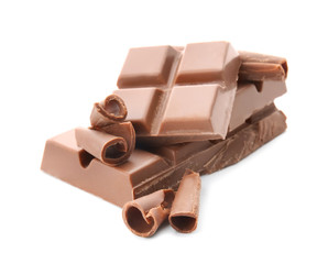 Pieces of chocolate with curls on white background