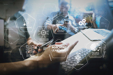 Coworking process, entrepreneur team working in creative office space. using digital tablet docking keybord and laptop with smartphone on marble desk,light beam effect