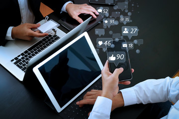 co working team meeting concept,businessman using smart phone and digital tablet and laptop computer and name tag in modern office