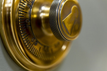 Combination safe lock, in golden duotone.
