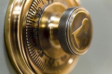 Combination safe lock, in golden duotone.