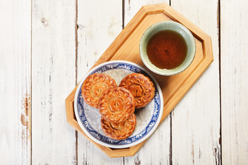 White lotus seed paste mooncake with egg yolk on the plate    