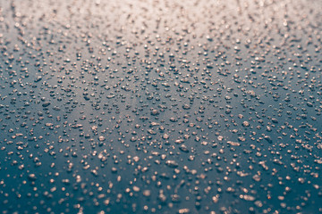 Close-up of frozen drops on the hood of the car, winter snow frosty weather - Powered by Adobe
