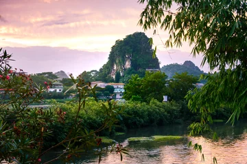 Foto op Canvas Sunset scene in Guilin, China, with stunning rock formation © creativefamily