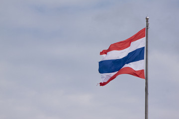 Thailand flag on the pole with sky is waving.