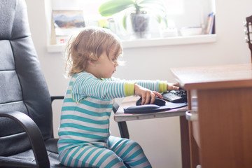 Fototapeta na wymiar Little Girl Using Computer