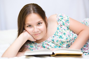 girl is reading a book