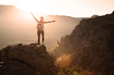 Beautiful woman on the top of mountain 