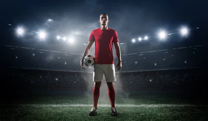 Foto auf Acrylglas Soccer player in the stadium background. © efks