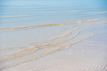 Beautiful white sand beach, clear wave water, white sand and sea nature sunshine time.Thailand.