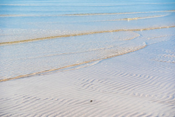 Beautiful white sand beach, clear wave water, white sand and sea nature sunshine time.Thailand.