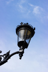 Fototapeta na wymiar Street light. Old Metal Lamp. Blue sky