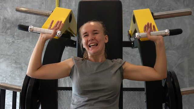 Young Woman Cannot Lift Weights in Gym. Challenge and Сopability Concept