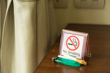 Do not smoke sign on table in room.Thailand.