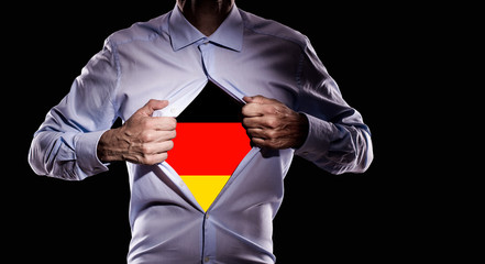 Business man with german flag on black background