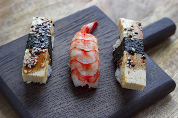 sushi on a wooden board,  close-up