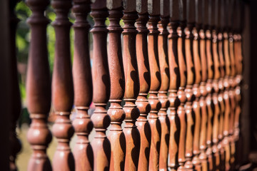 Close up row of wooden balustrade.