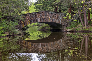 Stone Arch Bridge over calm water