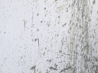 Fototapeta premium drops of mud on a white wall background