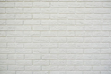 Fototapeta premium White brick wall. Stone wall texture. Decorative tile. Textured background. The white surface of the brick.
