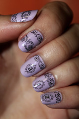purple nail polish with black patterns