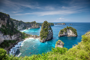 Aerial view of the small island of Nusa Batumategan and Nusa Batupadasan Island from the Atuh Rija...