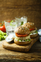 Homemade burgers with lettuce and tomato