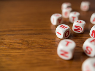 Letters dices on wooden table