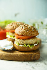 Homemade burgers with lettuce and tomato