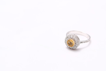 Yellow gem stone and diamond ring