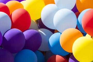 Background of a set of colored balloons on the sky background 