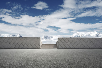 empty brick ground with sonw mountain as background