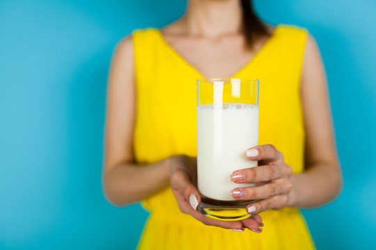 Woman holding a glass of milk