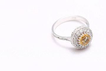Yellow gem stone and diamond ring