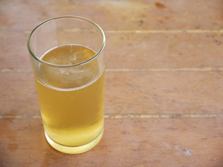 Glass with beer on the table
