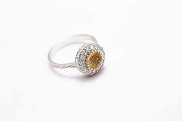 Yellow gem stone and diamond ring