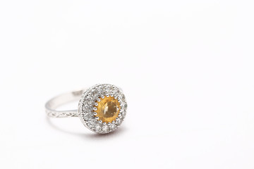Yellow gem stone and diamond ring