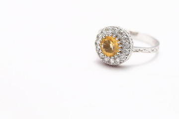 Yellow gem stone and diamond ring