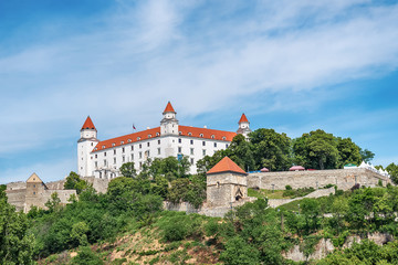 Naklejka premium Bratislava, Slovakia - May 24, 2018: View of Bratislava castle which occupies a prominent location in the city overlooking the Danube river. 