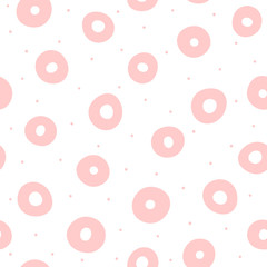 Repeating pink circles and round dots on white background. Cute geometric seamless pattern drawn by hand. Sketch, doodle.