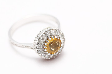 Yellow gem stone and diamond ring